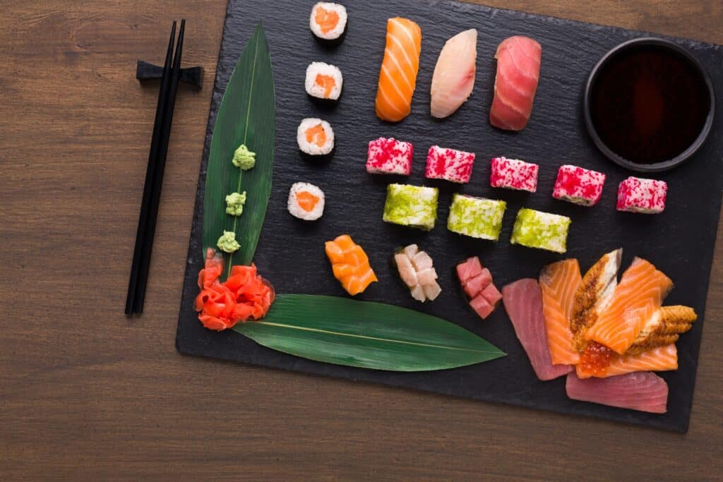 https://adcsalmon.com/wp-content/uploads/2019/07/set-of-assorted-sushi-maki-and-rolls-on-rustic-SCR3N6E-min-1024x683.jpg